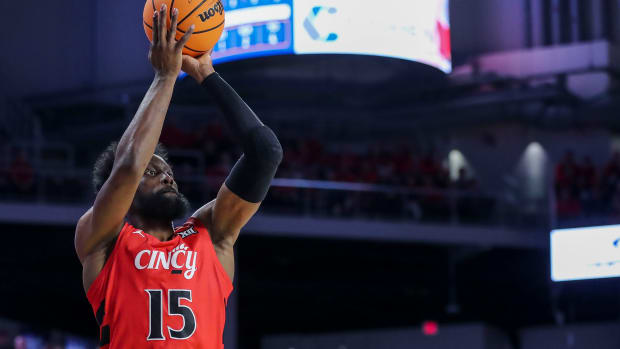Mar 9, 2024; Cincinnati, Ohio, USA; Cincinnati Bearcats forward John Newman III (15) shoots against the West Virginia Mountaineers in the first half at Fifth Third Arena. Mandatory Credit: Katie Stratman-USA TODAY Sports
